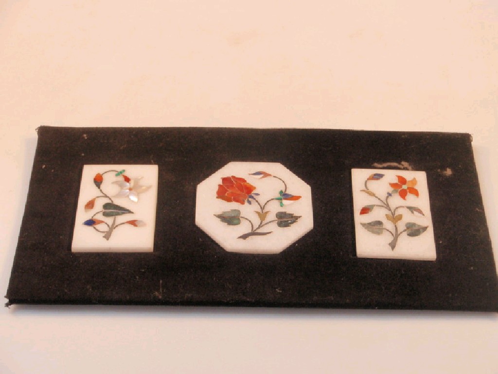 Appraisal: A pietra dura panel of three plaques on a velvet