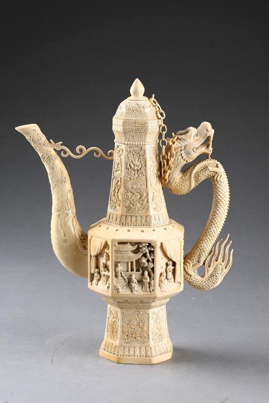 Appraisal: LARGE IVORY TEAPOT China th century Paneled teapot with dragon