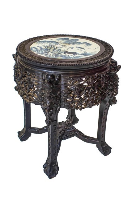 Appraisal: A late th century Chinese jardiniere stand with circular blue