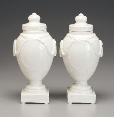 Appraisal: Pair Berlin porcelain urns raised swag and tassel decoration various