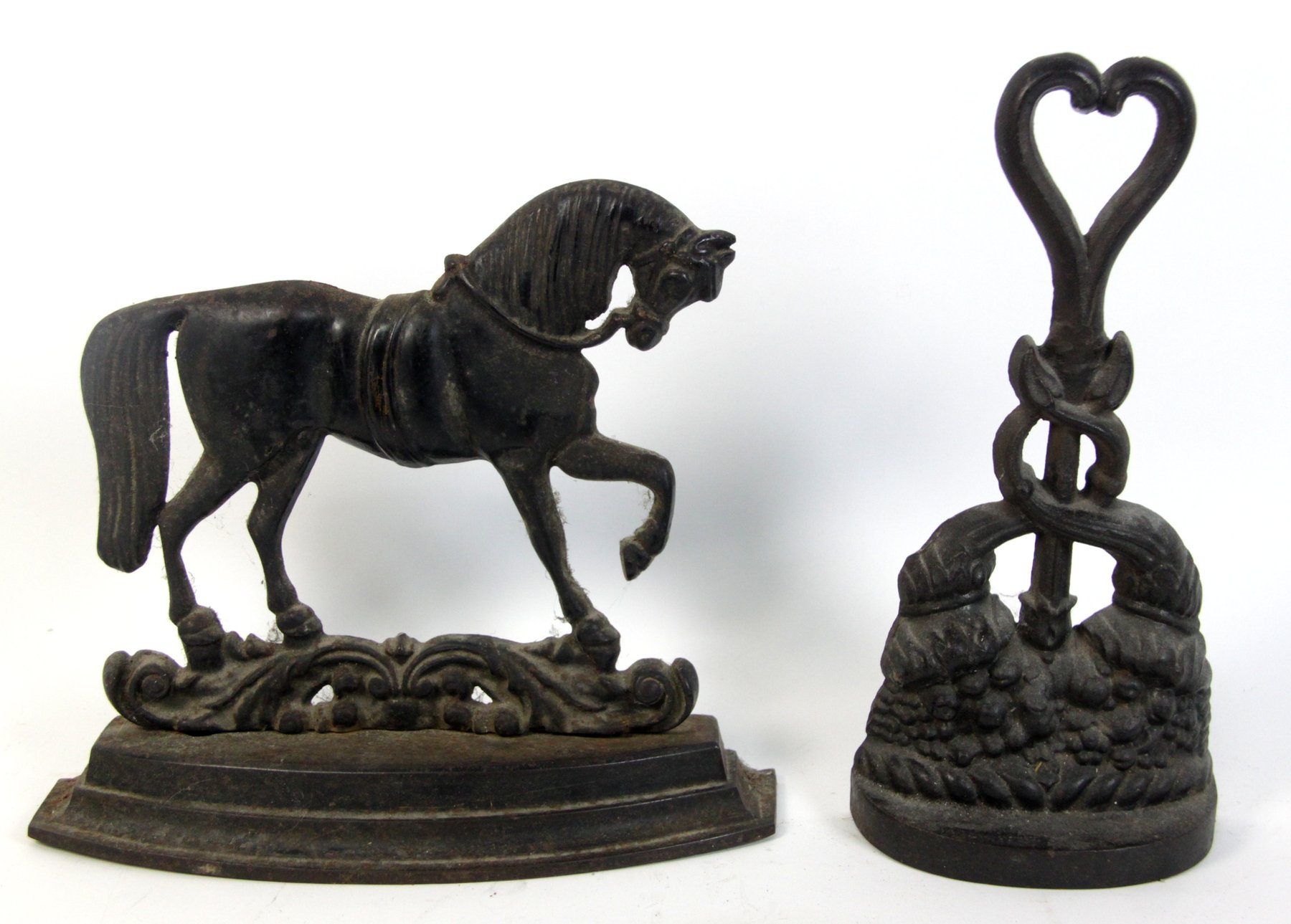 Appraisal: A cast iron horse door stop and another door stop