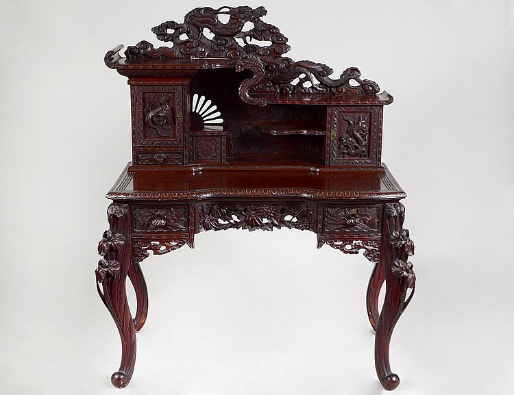 Appraisal: CHINESE-EXPORT CARVED WOOD WRITING DESKThe shaped writing surface with a