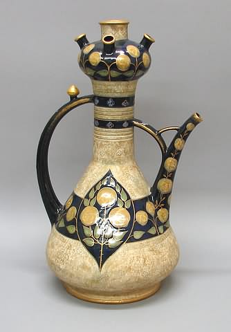 Appraisal: Flask form with spouts at top stylized yellow flowers on