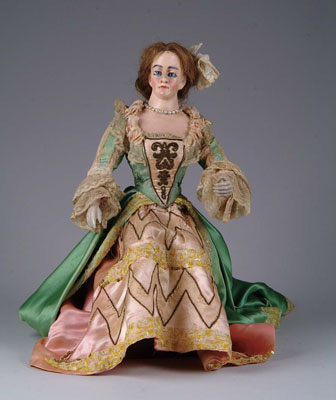 Appraisal: GLASS EYED PAPIER MACH LADY A majestically dressed lady probably