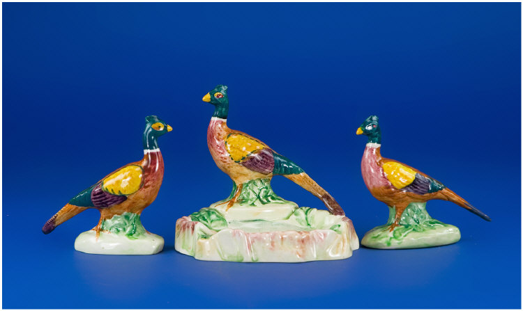 Appraisal: Two Beswick Pheasant Figures and a pheasant ashtray