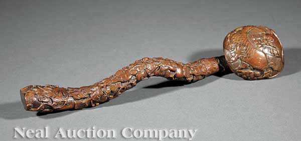 Appraisal: A Chinese Carved Boxwood Ruyi Scepter the naturalistic twisted shaft