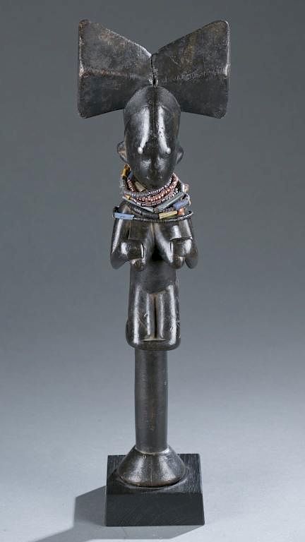 Appraisal: Shango staff with female figure A Shango staff with female