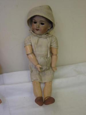 Appraisal: An Armand Marseille bisque head girl doll with sleeping glass