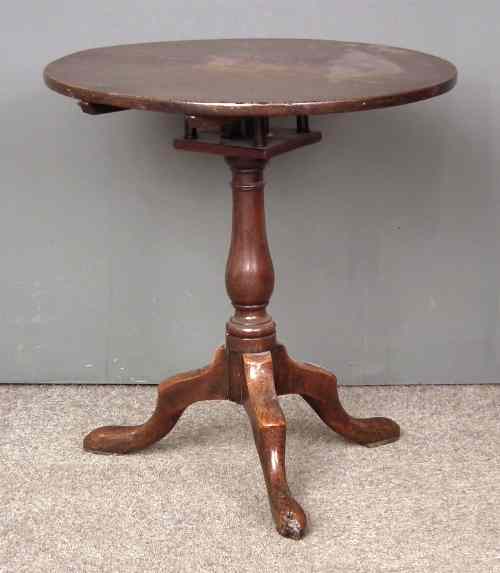 Appraisal: An th Century oak circular tripod table with plain top