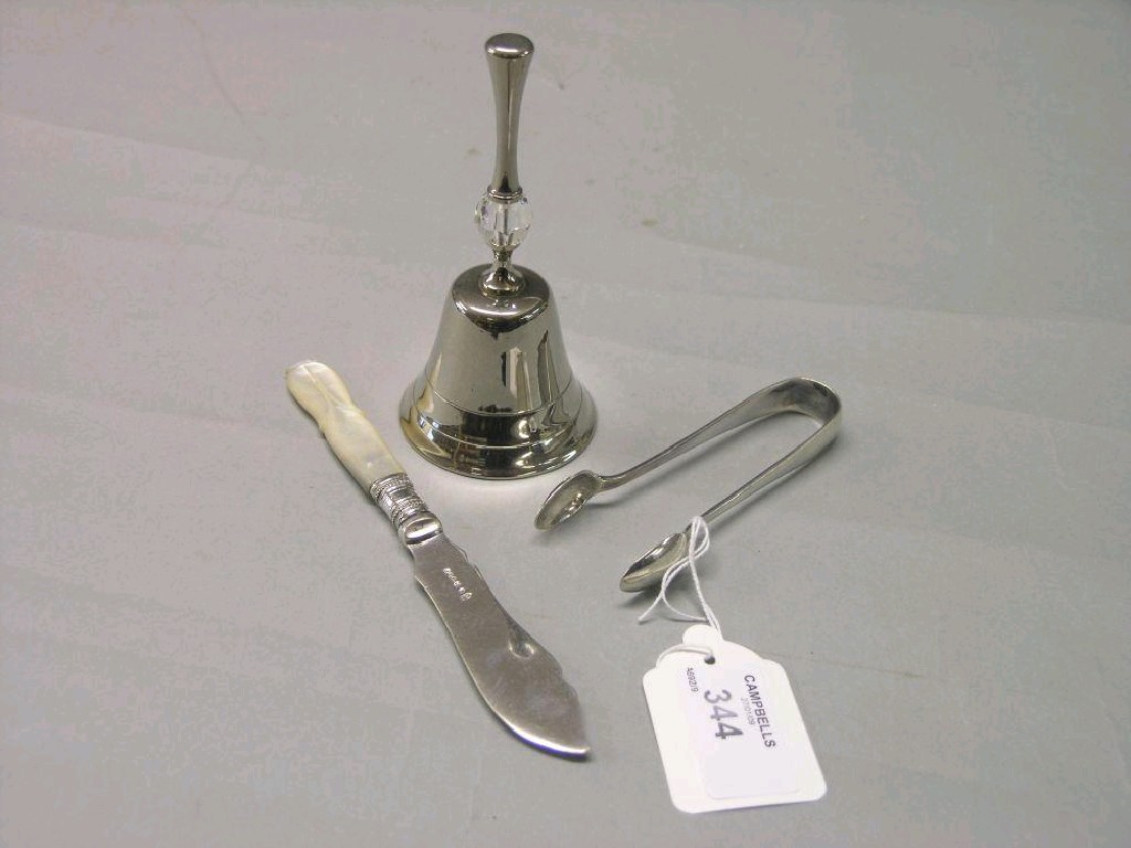 Appraisal: A pair of silver sugar tongs Sheffield together with a