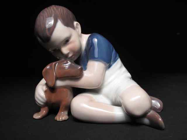 Appraisal: A Royal Copenhagen porcelain figurine depicting a boy and a