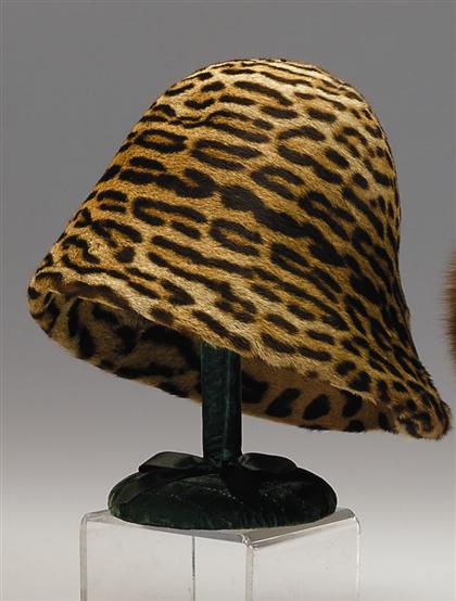 Appraisal: Sculptural spotted cat hat s Slant-brimmed cloche with round crown