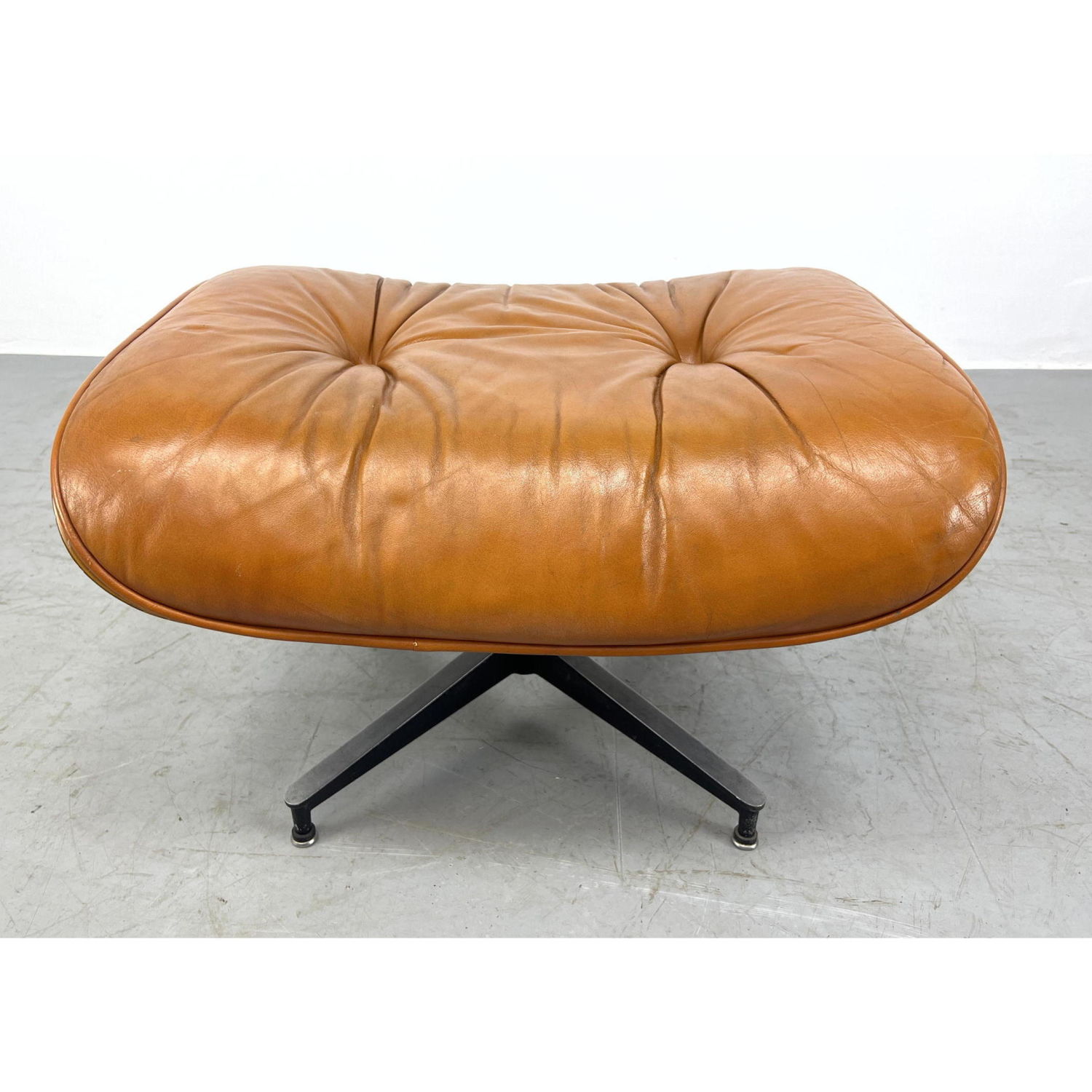 Appraisal: CHARLES EAMES Rosewood Ottoman Brown Leather upholstery HERMAN MILLER Label