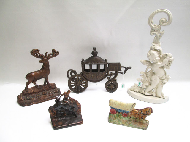 Appraisal: FIVE METAL DOOR STOPS AND BOOK ENDS the covered wagon