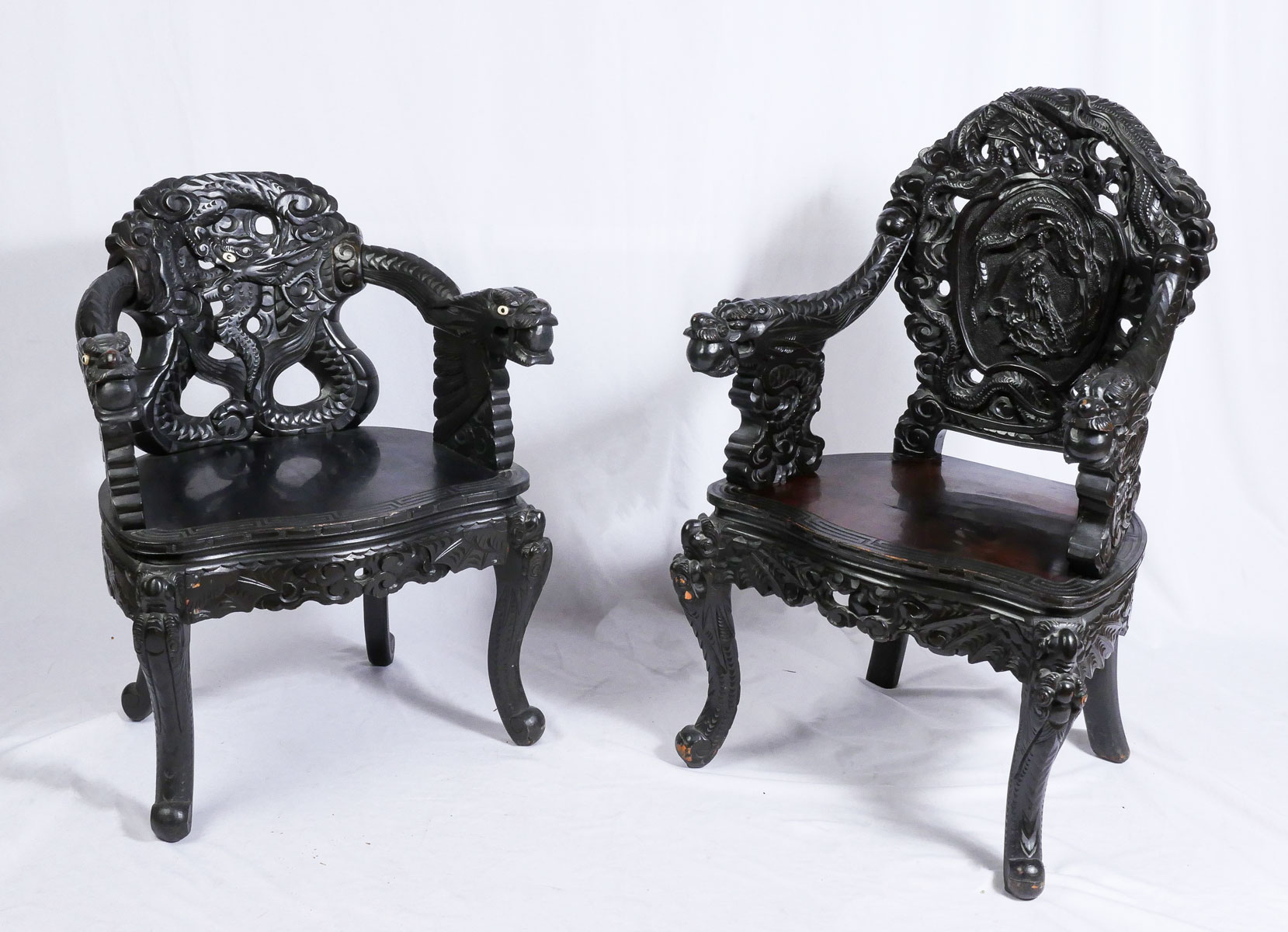 Appraisal: JAPANESE CARVED LACQUERED DRAGON CHAIRS Both having an overall Dragon