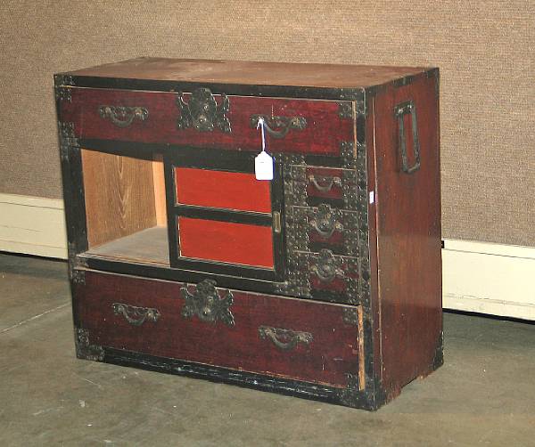 Appraisal: A mixed wood single section tansu Fitted with wrought iron