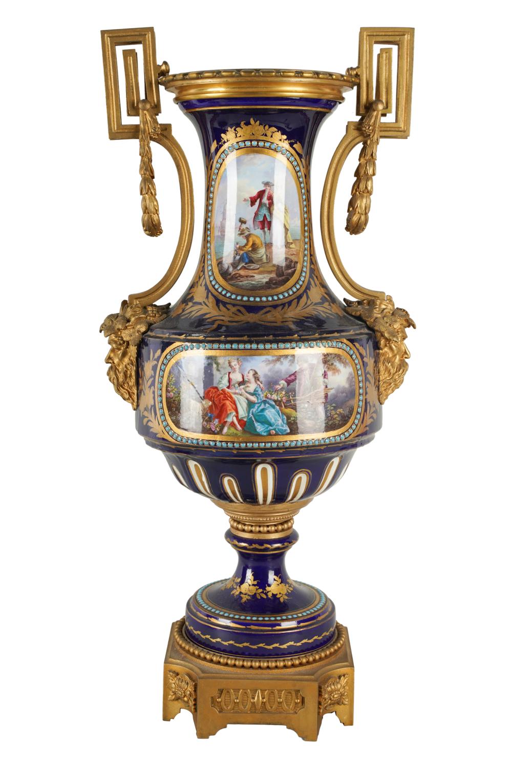 Appraisal: SEVRES-STYLE GILT BRONZE-MOUNTED PORCELAIN URNpainted to one side with two