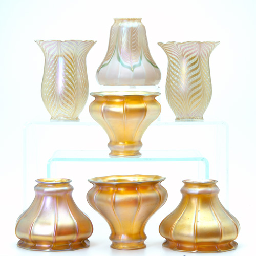 Appraisal: QUEZAL Seven art glass shades four gold fluted and three