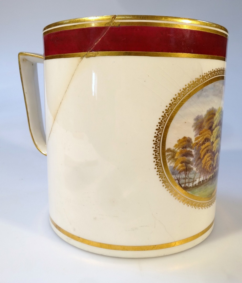 Appraisal: An thC Derby porcelain porter mug the cylindrical body decorated