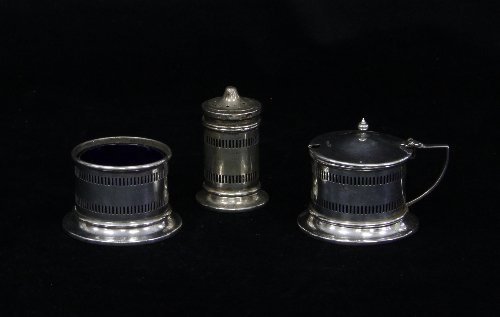 Appraisal: A three-piece silver cruet Sheffield of circular form with pierced