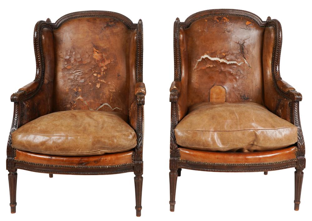 Appraisal: PAIR OF LOUIS XVI-STYLE BERGERES A L'OREILLESwith leather and linen