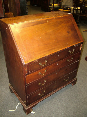 Appraisal: A George III mahogany bureau the crossbanded fall front with