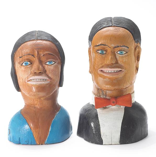 Appraisal: Two carved and polychromed wood heads of a man and