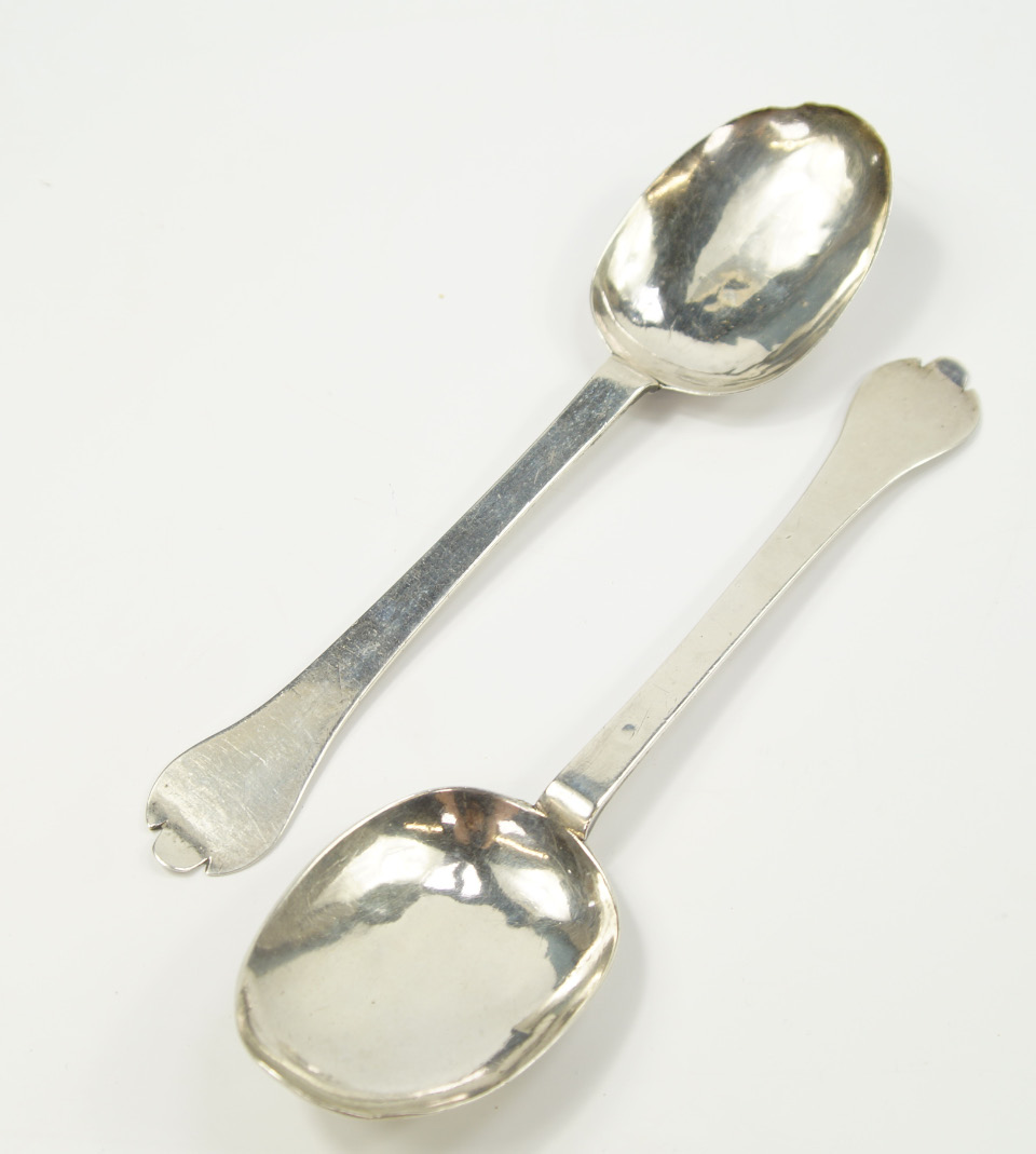 Appraisal: A pair of William Mary silver trefid spoons monogrammed London