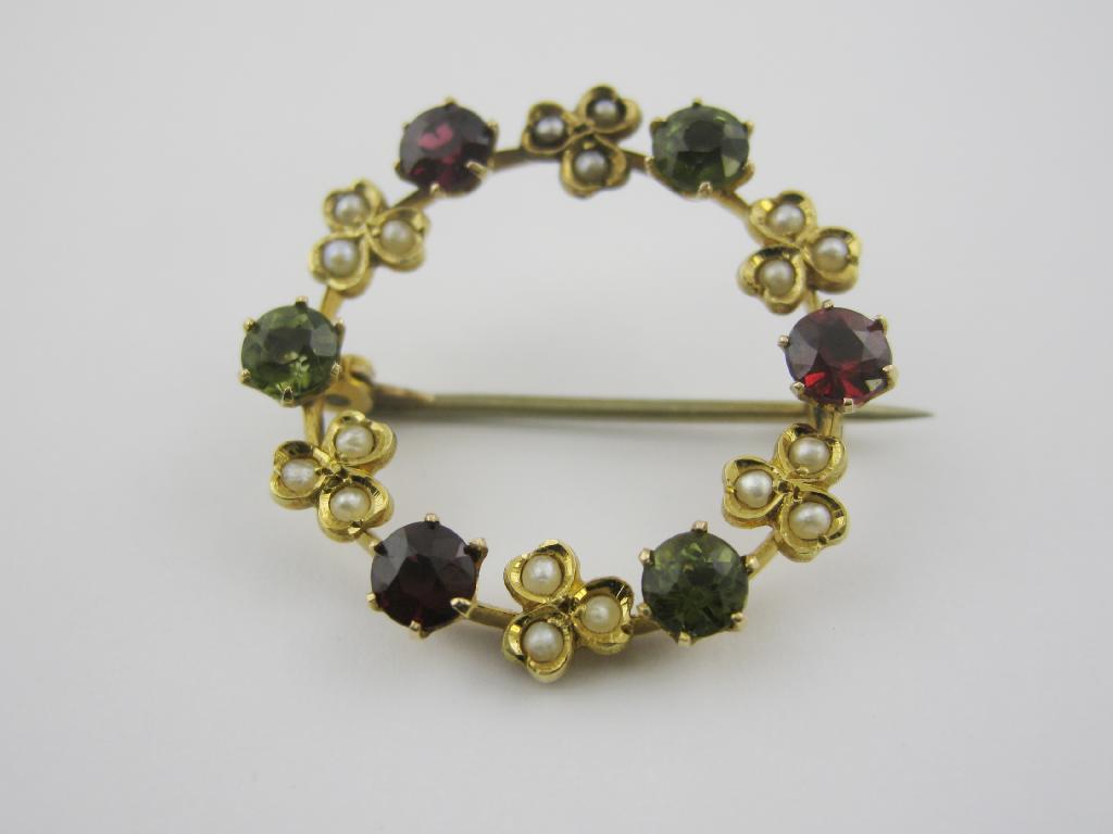 Appraisal: A Peridot Garnet and Seed Pearl Wreath Brooch the circular-cut