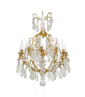 Appraisal: A LOUIS XV STYLE GILT METAL AND CRYSTAL SIX-LIGHT CHANDELIER