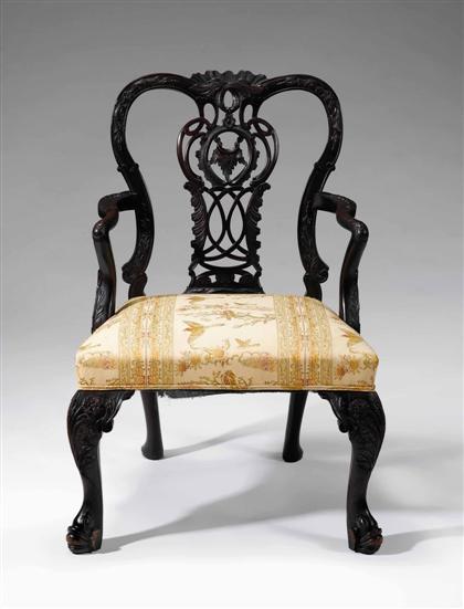 Appraisal: Irish George III style carved mahogany armchair With a carved