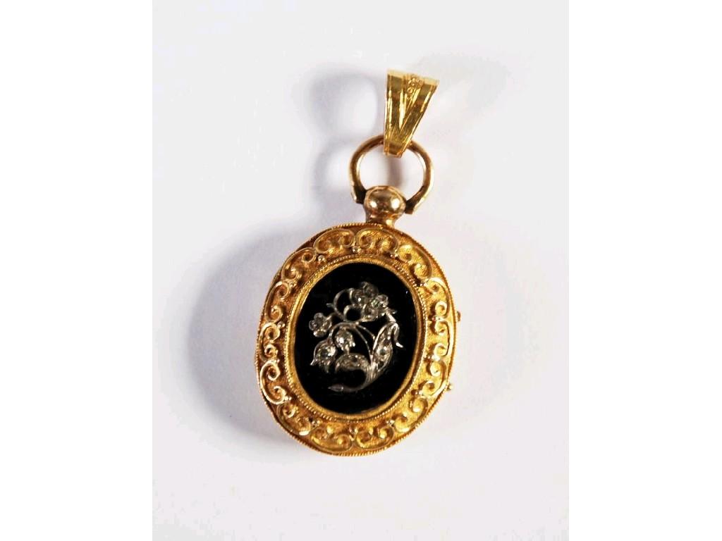 Appraisal: VICTORIAN GOLD AND OVAL LOCKET PENDANT the black enamelled centre