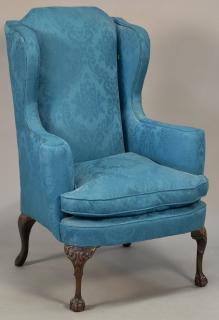 Appraisal: Chippendale style upholstered wing chair Chippendale style upholstered wing chair