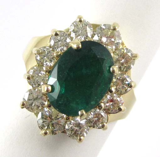 Appraisal: EMERALD DIAMOND AND FOURTEEN KARAT GOLD RING with twelve radiant