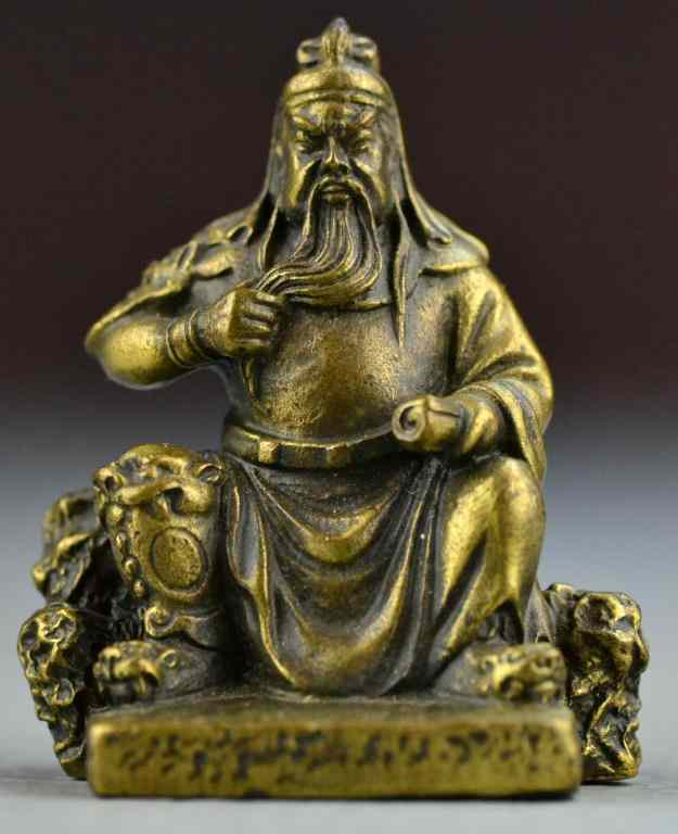 Appraisal: Chinese Qing Bronze WarriorFinely molded to depict a seated warrior