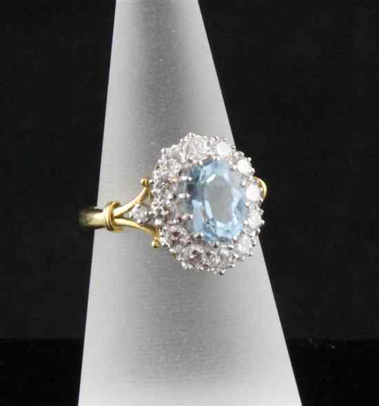 Appraisal: A 's ct gold aquamarine and diamond cluster ring the