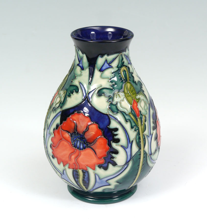 Appraisal: MOORCROFT POPPY VASE Raised poppy design impressed Moorcroft stamp underglaze