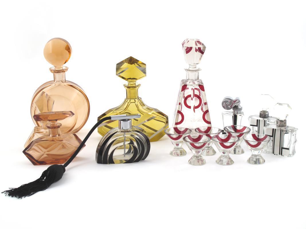 Appraisal: An enamelled glass decanter and six shot glasses