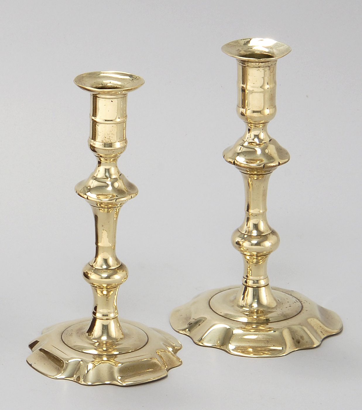 Appraisal: PAIR OF QUEEN ANNE BRASS CANDLESTICKS Mid- th CenturyWith petal-form