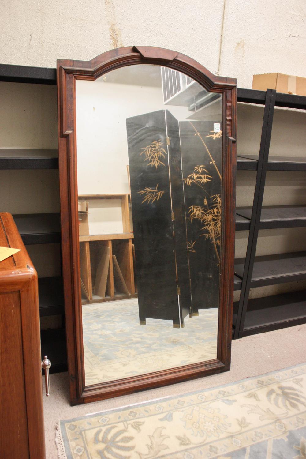 Appraisal: LARGE PIER MIRROR in a molded walnut frame with arched