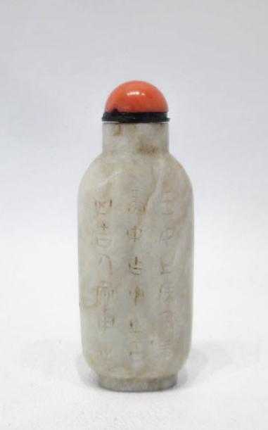 Appraisal: CHINESE CARVED JADE SNUFF BOTTLE of slender compressed form in