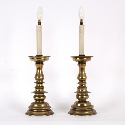 Appraisal: A pair of European brass pricket candlesticks with ringed baluster