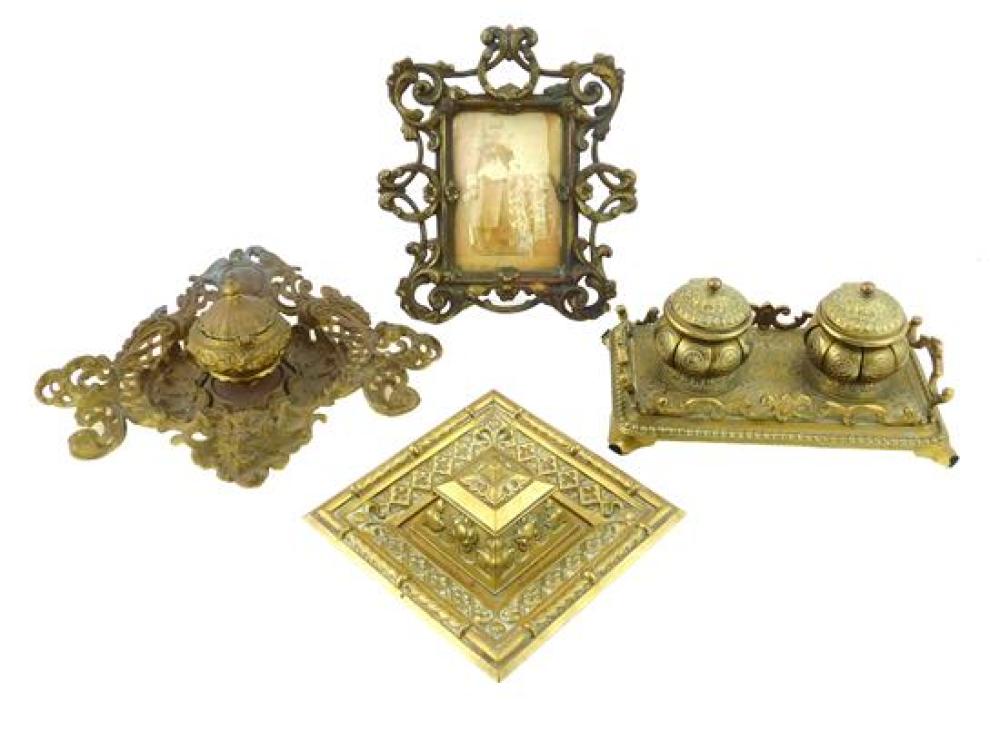 Appraisal: Four ornate cast metal inkwells and frame th C bronze