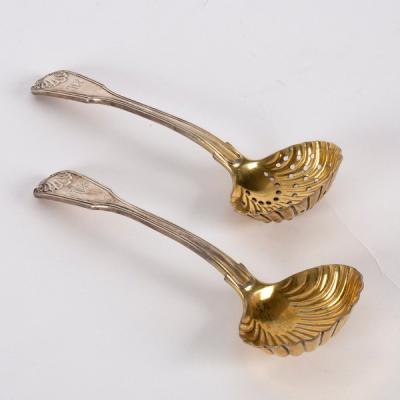 Appraisal: A pair of fiddle thread and shell pattern silver sugar