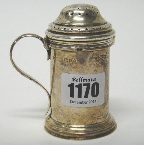 Appraisal: A silver cylindrical pepper caster with a scrolling handle in