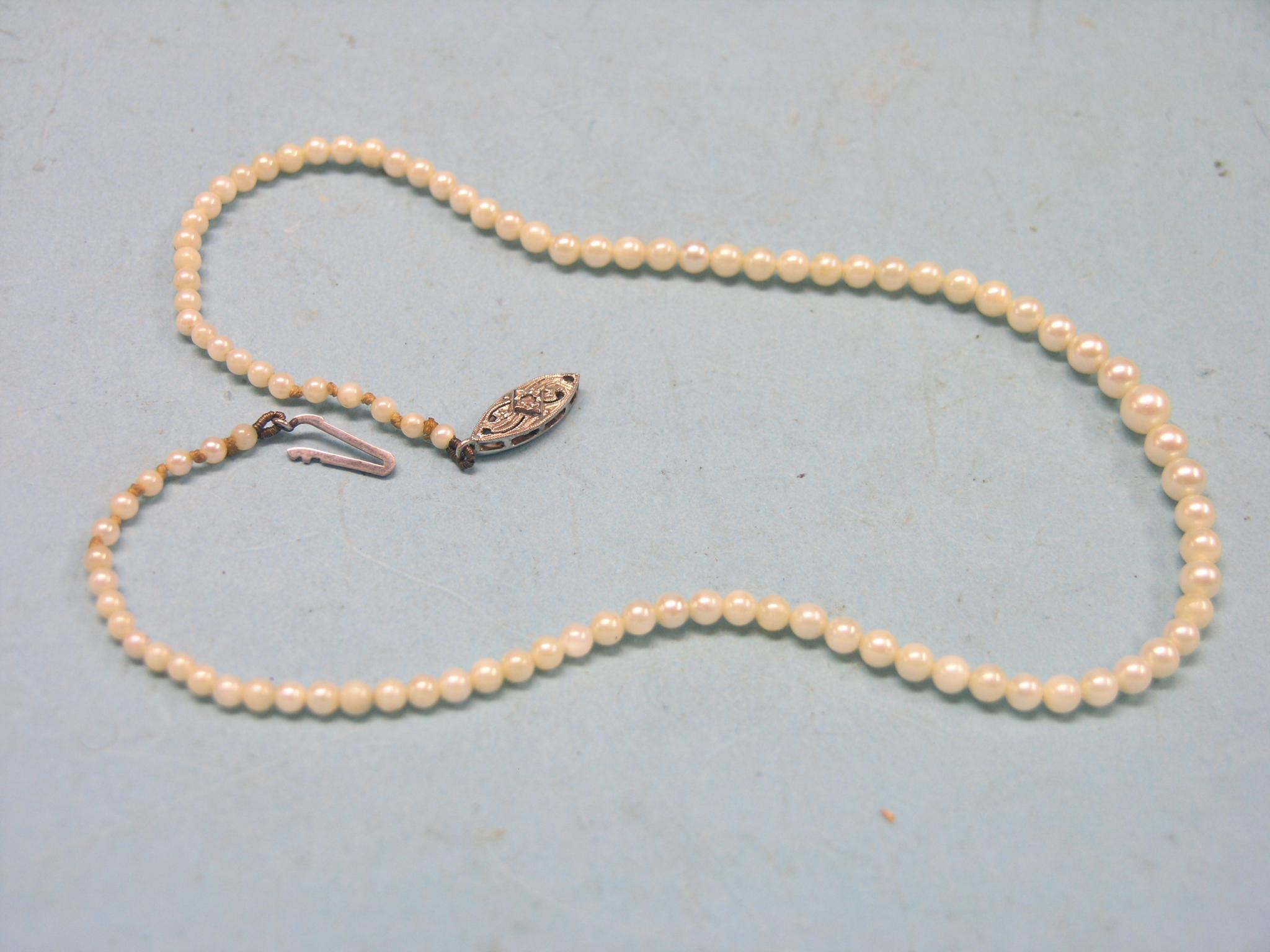 Appraisal: A cultured pearl necklace graduated pearls on ct white gold