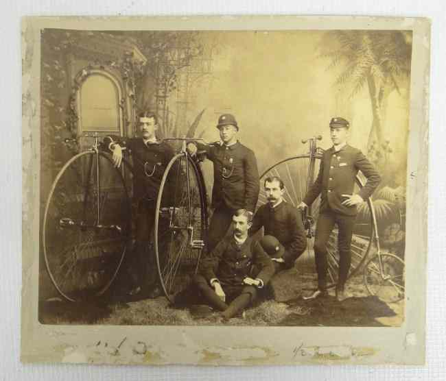 Appraisal: th c Studio posed group photograph of uniformed wheelmen Photographer