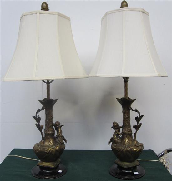 Appraisal: PAIR OF EWERS A pair of antique base metal single