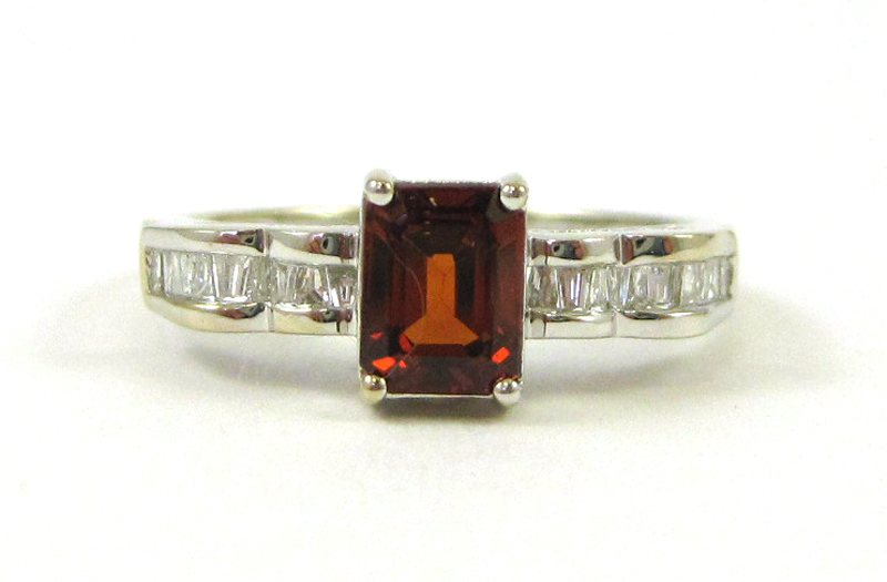 Appraisal: SPESSARTITE GARNET AND DIAMOND RING k white gold with tapered