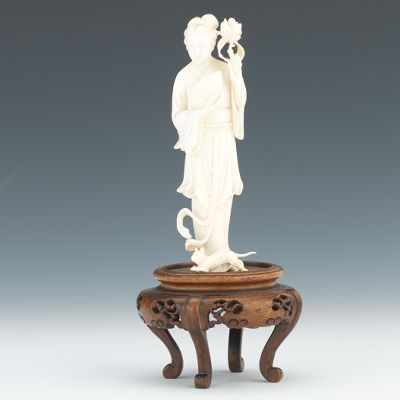 Appraisal: Carved Ivory Quan Yin and Cat on Stand Nicely carved